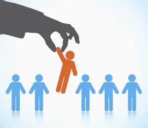 Hand picking a person from a group of blue figures, symbolizing HR management and talent selection.