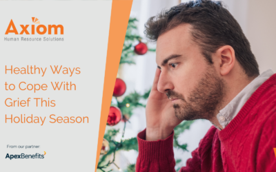 Axiom Human Resource Solutions image featuring a man with a pensive expression, reflecting on grief during the holiday season, with a Christmas tree in the background and text promoting healthy coping strategies.