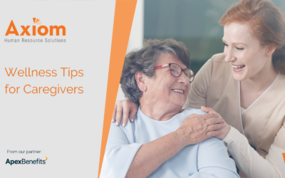 Axiom Human Resource Solutions wellness tips for caregivers, featuring a caregiver smiling and comforting an elderly woman, emphasizing support and compassion in caregiving.