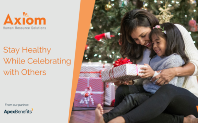 Axiom Human Resource Solutions promotional image featuring a woman and child exchanging a gift, emphasizing the theme "Stay Healthy While Celebrating with Others," set against a festive backdrop.