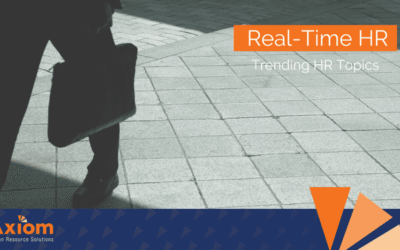 Real-Time HR graphic featuring a professional walking on a tiled surface with a briefcase, emphasizing trending HR topics relevant to workforce management in landscaping and field services.