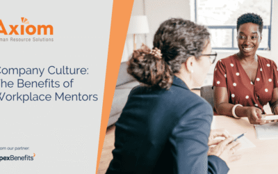 Axiom Human Resource Solutions image featuring two women engaged in a mentoring discussion, highlighting the benefits of workplace mentorship in enhancing company culture and employee connection.