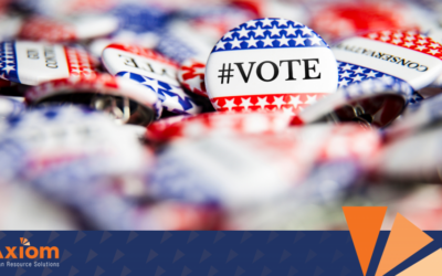 Buttons with "#VOTE" and "CONCERNED" text, featuring red, white, and blue colors, representing voting awareness and compliance, aligned with Axiom Human Resource Solutions' focus on HR practices and election day laws.