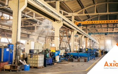 Manufacturing HCM Solutions 5 Human Capital Management Solutions for Manufacturing Manufacturing facility interior showcasing production equipment and machinery, emphasizing productivity and operational efficiency, with Axiom Human Resource Solutions branding.