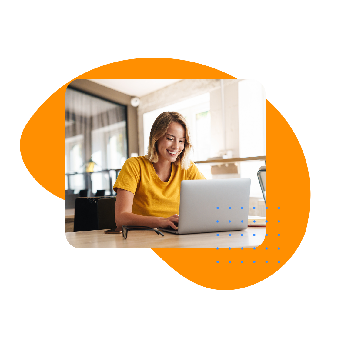 UKG Product Guide Downloads Smiling woman in yellow shirt using laptop at a desk, representing HR professionals engaging with UKG product guides for workforce management solutions.